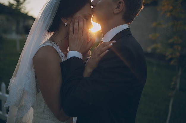 Groom kissing the bride's forehead