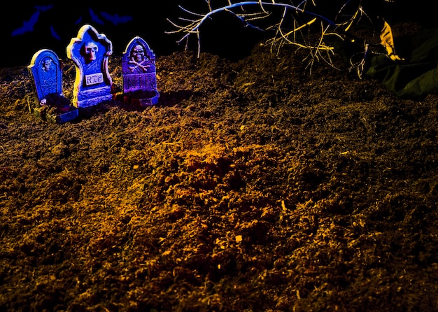 Ground with graves and shining violet headstones