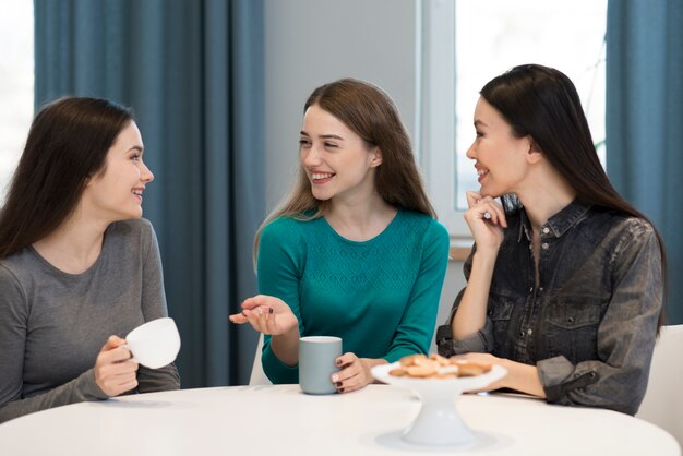 Group of adult women enjoying coffee in the morning