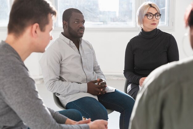 Group of adults looking at each other