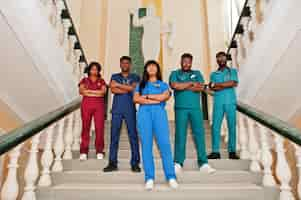 Free photo group of african medical students in college standing on stairs