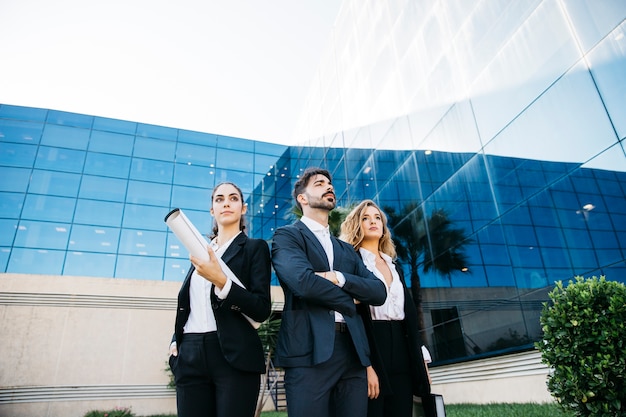 Group of architects in front of modern building