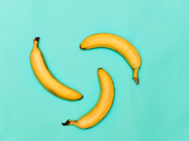 The group of bananas against blue background