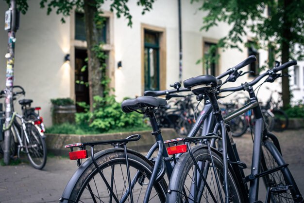 A group of bicycles in the parking lot blurred background