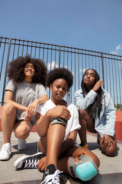 Group of black girls spending time together outdoors