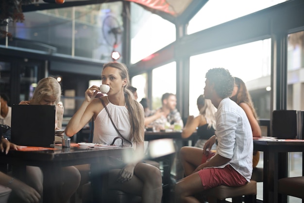 group of boys and girls in a bar