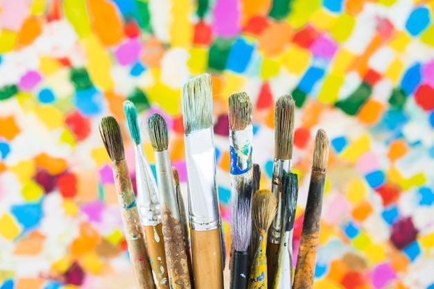 Group of brushes on colorful background