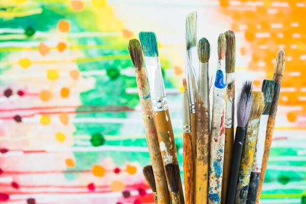 Group of brushes on colorful background
