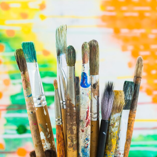 Group of brushes on colorful background