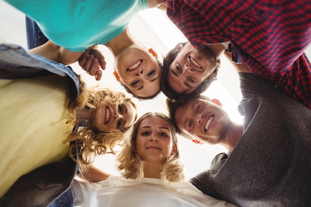 Group of business executives forming huddle