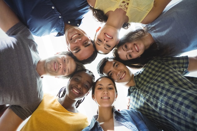 Free photo group of business executives forming huddle