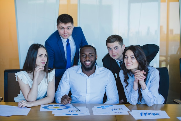 Group of business people looking at camera