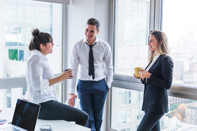 Group of businesspeople standing in the office