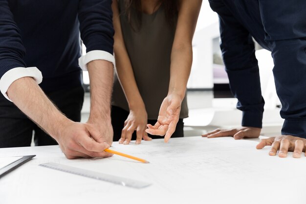 Group of businesspeople working at a table in the office