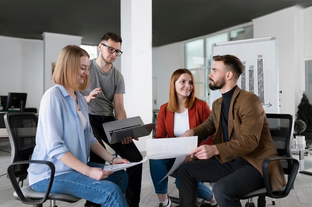 group of coworkers at the office talking