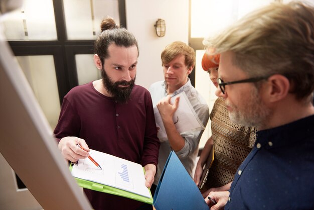 Group of creative people analyzing the result of work