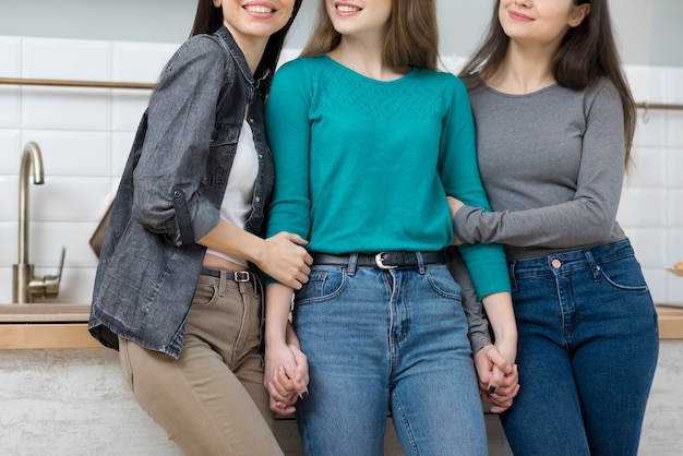 Free photo group of cute young women posing together