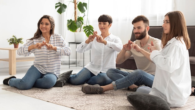 Group of deaf people communicating through sign language