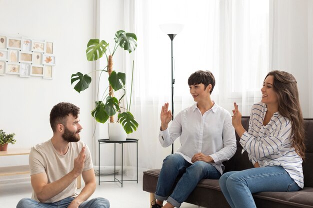 Group of deaf people communicating through sign language