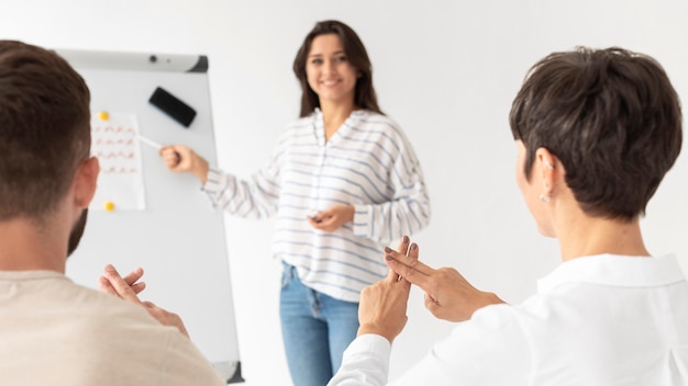 Group of deaf people communicating through sign language