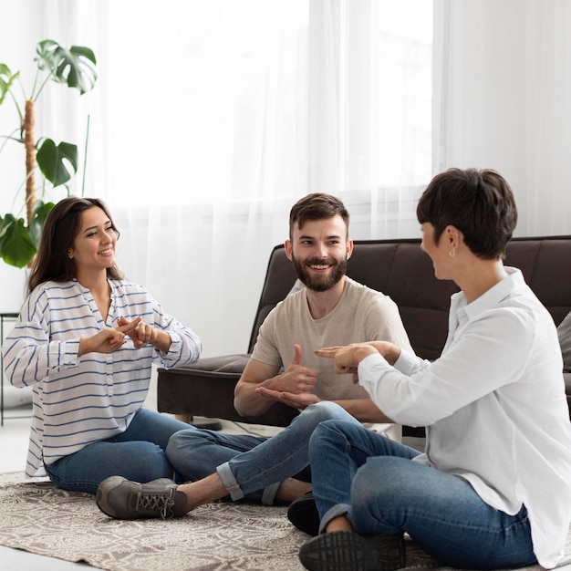 Group of deaf people communicating through sign language