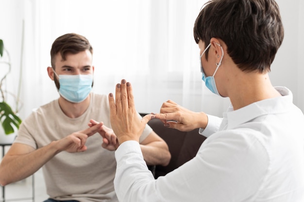 Group of deaf people communicating through sign language