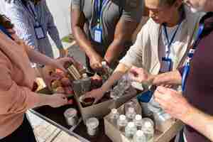 Free photo group of different people volunteering at a foodbank for poor people