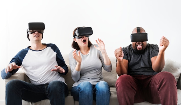 Group of diverse friends enjoying virtual reality experience