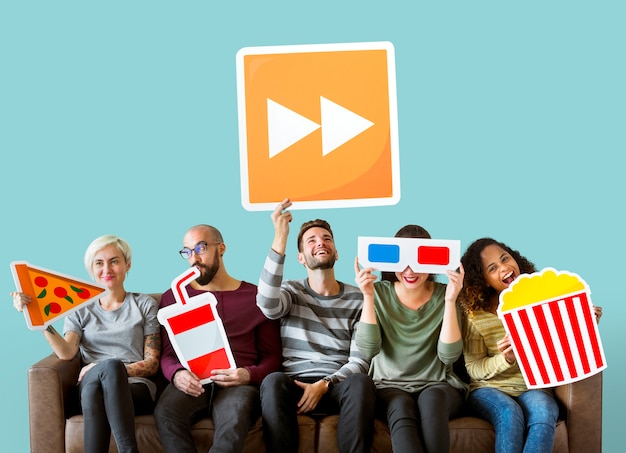 Free photo group of diverse friends holding movie emoticons