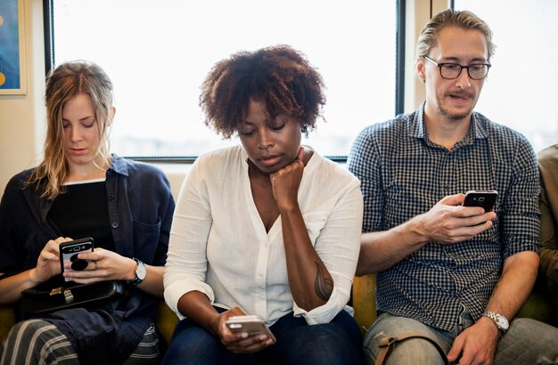 Group of diverse people riding a train