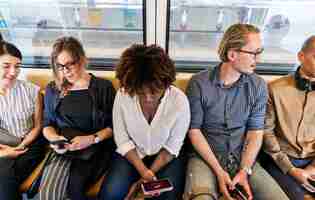 Free photo group of diverse people riding a train