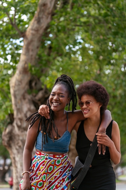 Free photo group of female friends enjoying a day out together