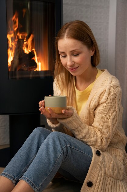 Group of female friends watching sports at home and having a drink