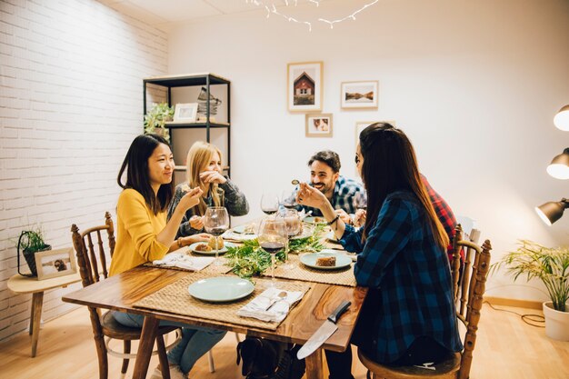 Group of five friends at table