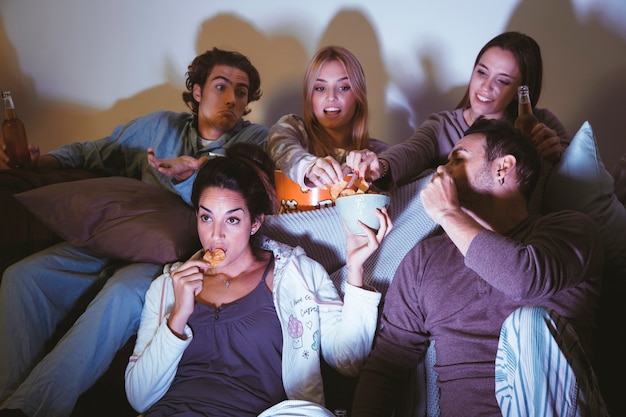 Group of five friends watching a movie