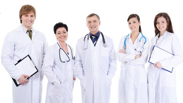 Group of five laughing successful doctors standing together