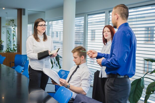 Group of four coworkers in office