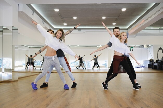 Premium Photo | Group of four hip-hop dancers