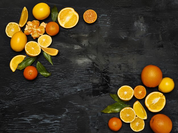 group fresh fruits against black