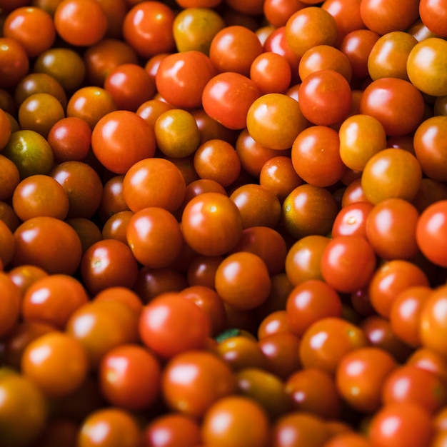 Free photo group of fresh juicy cherry tomato for sale
