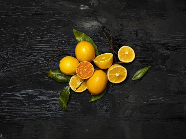 The group of fresh lemons on black space