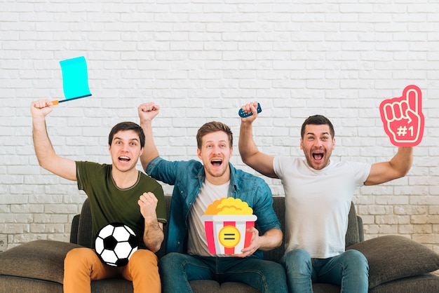 Free photo group of friends being cheerful of a couch