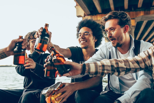 Group of friends celebrating, resting, having fun and party in summer day