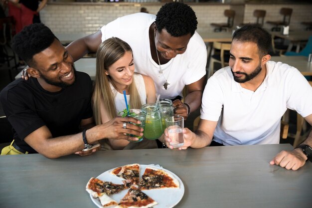 Group of friends clinking glasses