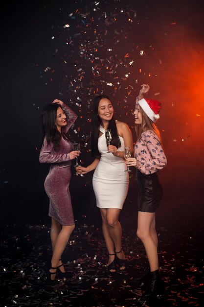 Group of friends dancing at new years party