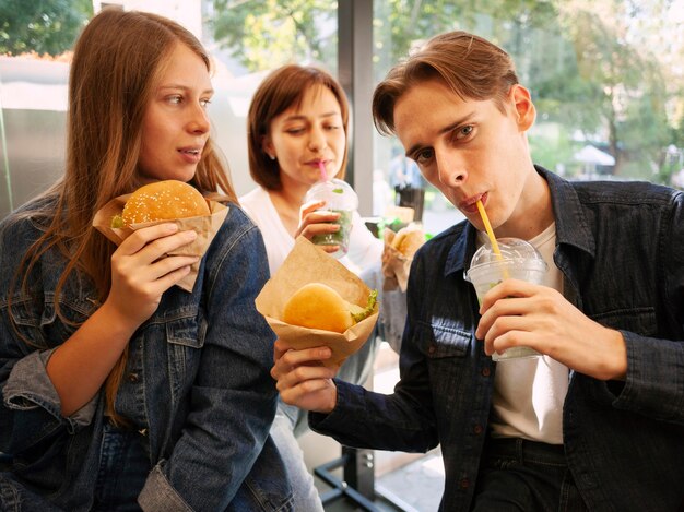 Group of friends eating fast food