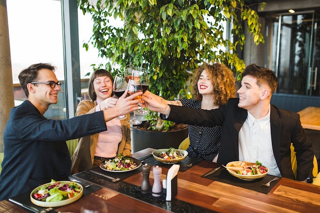 Group of friends eating in restaurant