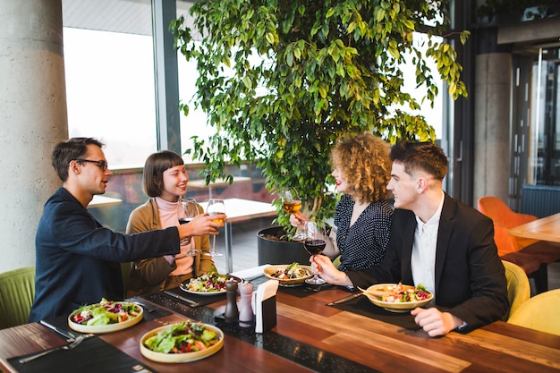 Group of friends eating in restaurant