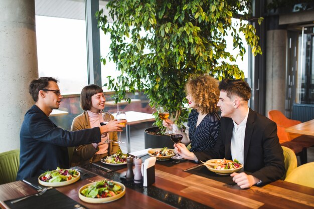 Group of friends eating in restaurant