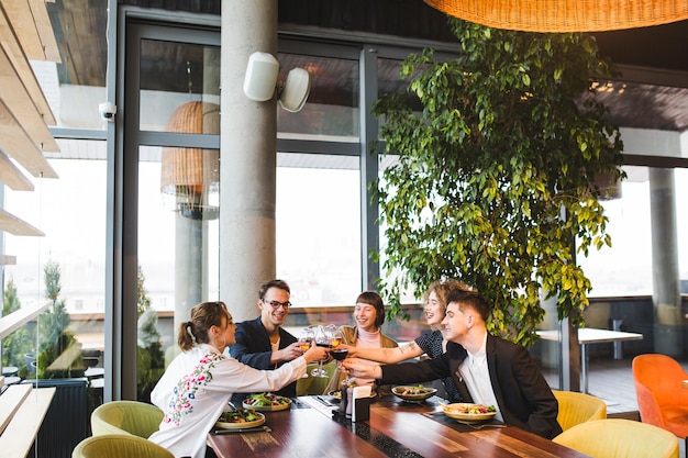 Group of friends eating in restaurant